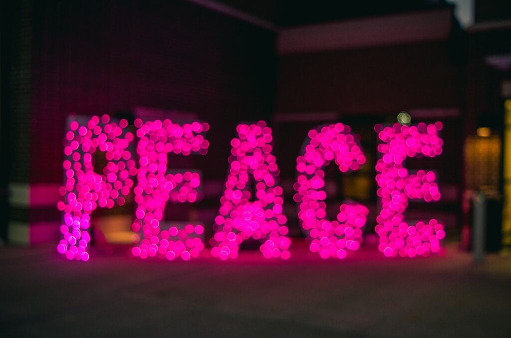 Pink bokeh forming the word peace